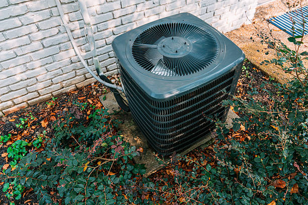Bell Gardens Air Repair technician servicing an HVAC system in Bell Gardens, CA